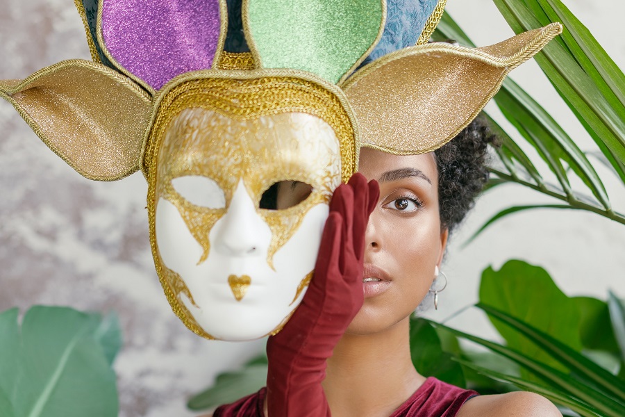 Cheap Mardi Gras Party Decorations A Woman Standing with a Mardi Gras Mask Covering Half Her Face