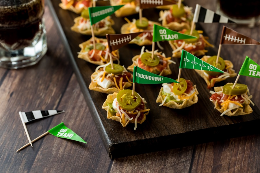 Game Day Charcuterie Board Ideas Close Up of Tiny Taco Cup Appetizers with Little Flags in Them 