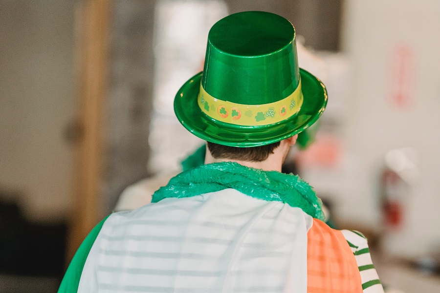 Green Recipes for St Patricks Day Close Up of the Back of a Guy Wearing an Irish Flag as a Cape and a Leprechaun Hat