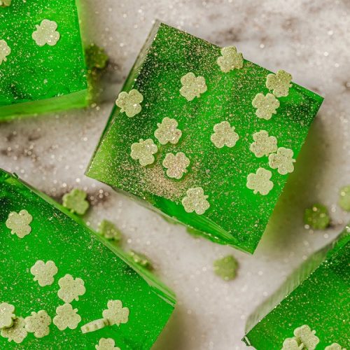 St. Patrick's Day Jello Shot Recipe Overhead View of Green Jello Shots with Shamrock Sprinkles