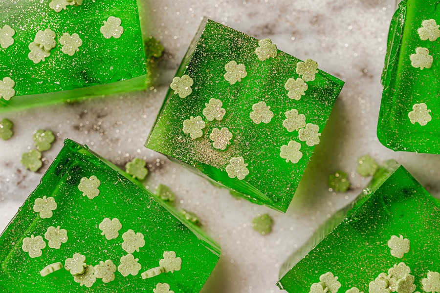 St. Patrick's Day Jello Shot Recipe Overhead View of Green Jello Shots with Shamrock Sprinkles