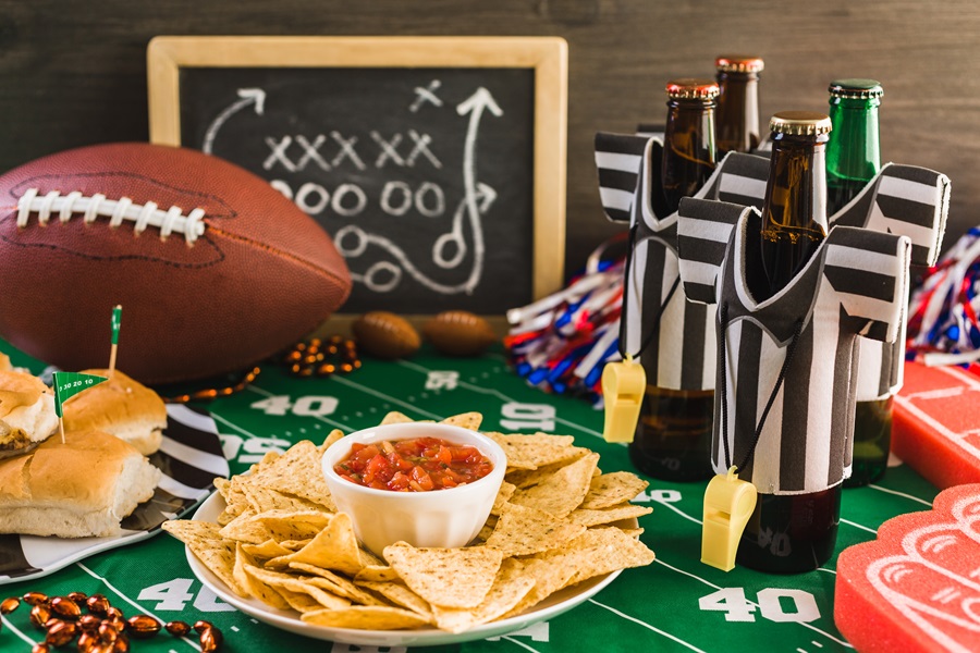 Game Day Charcuterie Board Ideas Close Up of a Food Table at a Game Day Party with Football-Themed Decorations