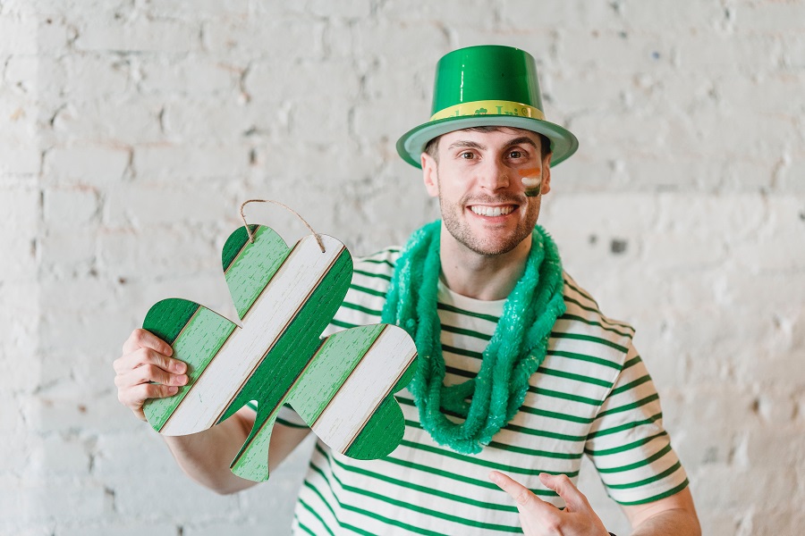 Green Recipes for St Patricks Day a Guy Dressed in Green and White Stripes Wearing a Leprechaun Hat Holding Up a Shamrock