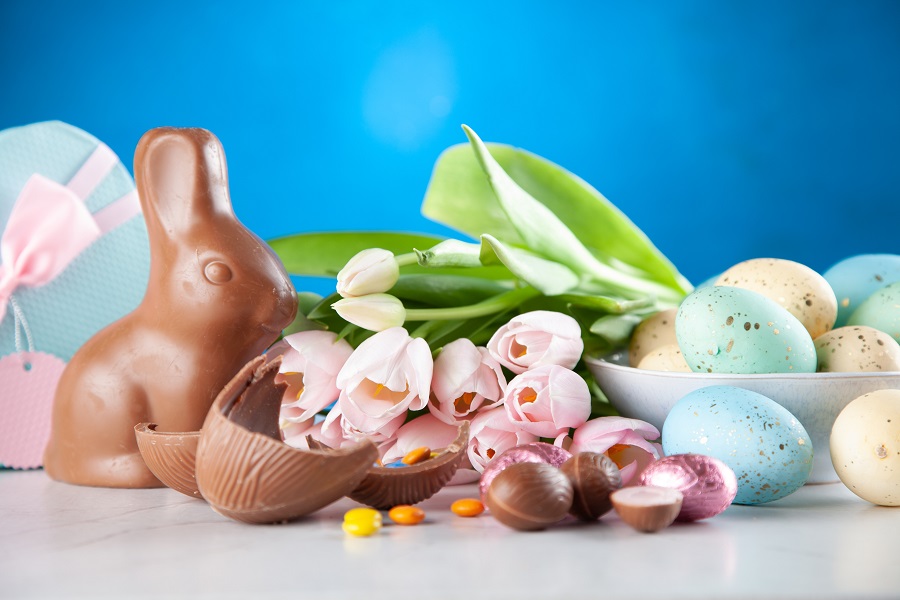 Easter Decorations Assorted Easter Candies on a Table with a Blue Background