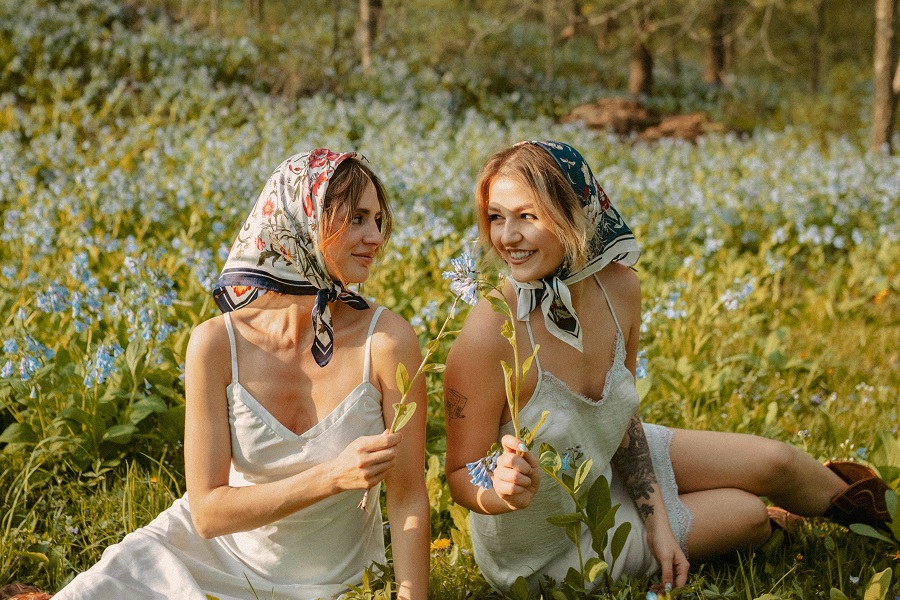 Funny Sibling Quotes for National Siblings Day Two Sisters Posing for a Picture in a Field