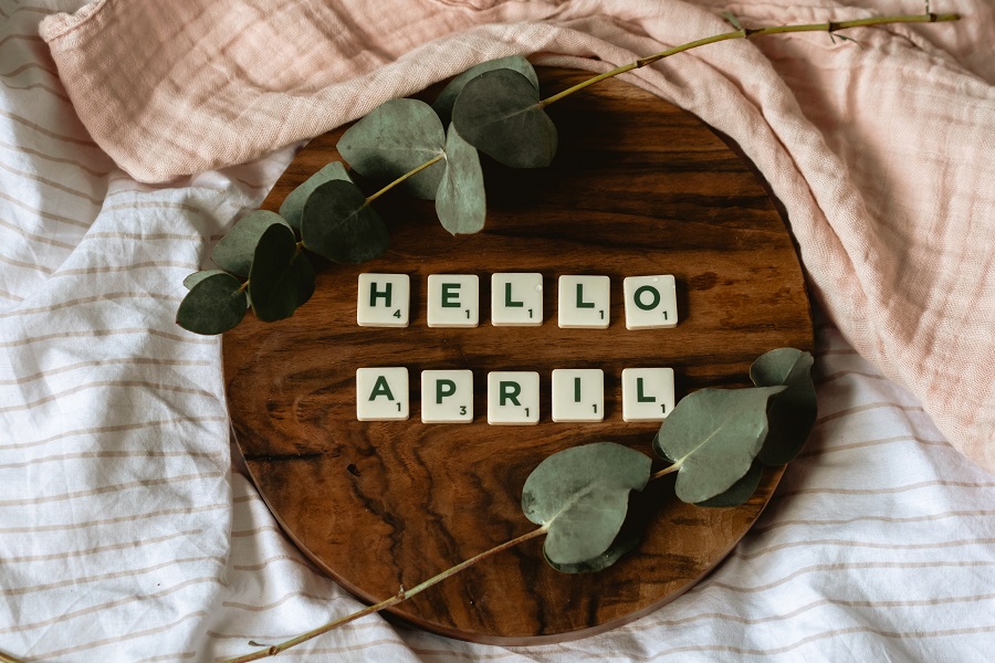 Funny April Fools Day Quotes Letter Tiles on a Wooden Surface Spelling Out "Hello April"