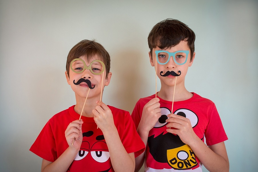 Funny April Fools Day Quotes Two Young Boys Holding Up Fake Glasses and Mustaches to Their Faces