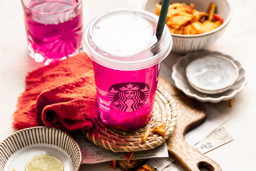 Starbucks Mango Dragon Fruit Refresher Copycat Recipe Starbucks Cup Filled with Refresher Next to Leftover Ingredients