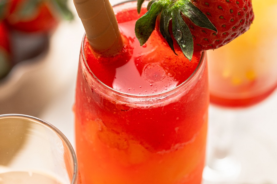 Sunrise Strawberry Mimosa Recipe Close Up of a Glass of Strawberry Mimosa