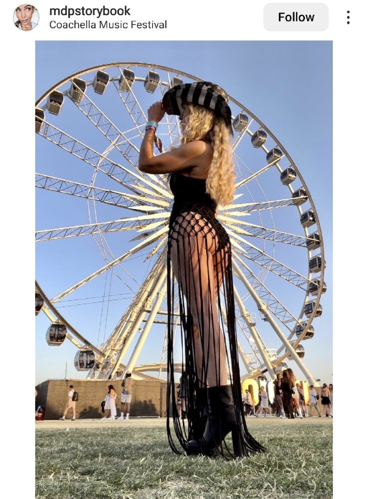 Festival Outfit Inspiration  Woman Standing in Front of a Ferris Wheel Wearing a Dress Made of Tassels 