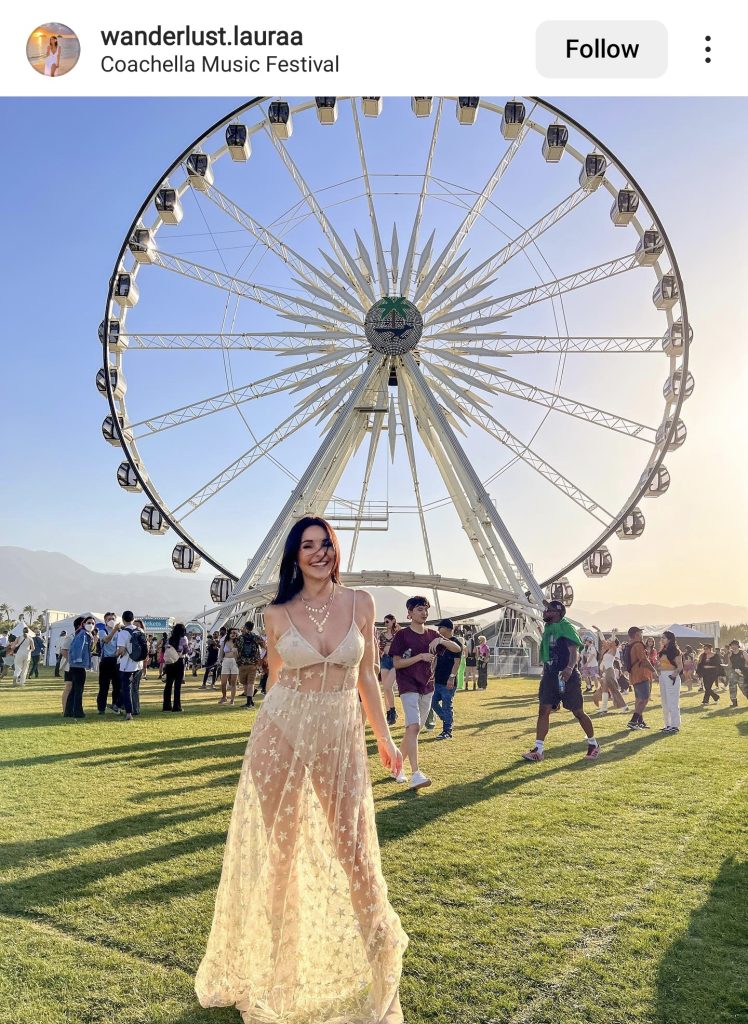 Festival Outfit Inspiration  Woman Standing in Front of a Ferris Wheel at Coachella Wearing a Sheer Dress