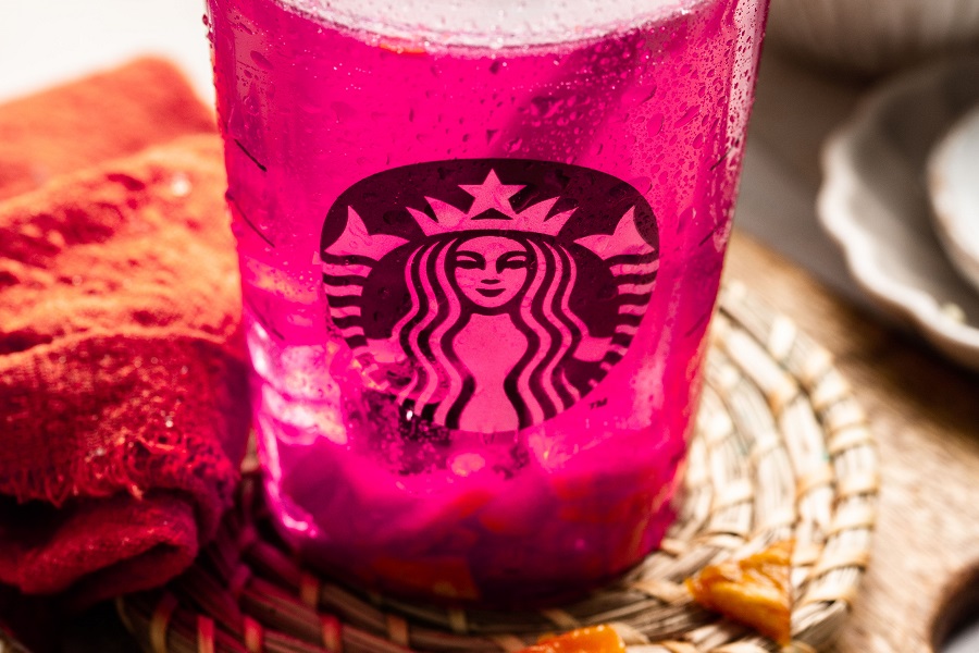 Starbucks Mango Dragon Fruit Refresher Copycat Recipe Close Up of a Starbucks Cup with a Pink Drink Inside