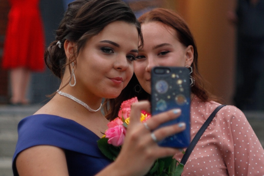 Prom Hairstyle Ideas Two Teen Girls Taking a Selfie at Prom
