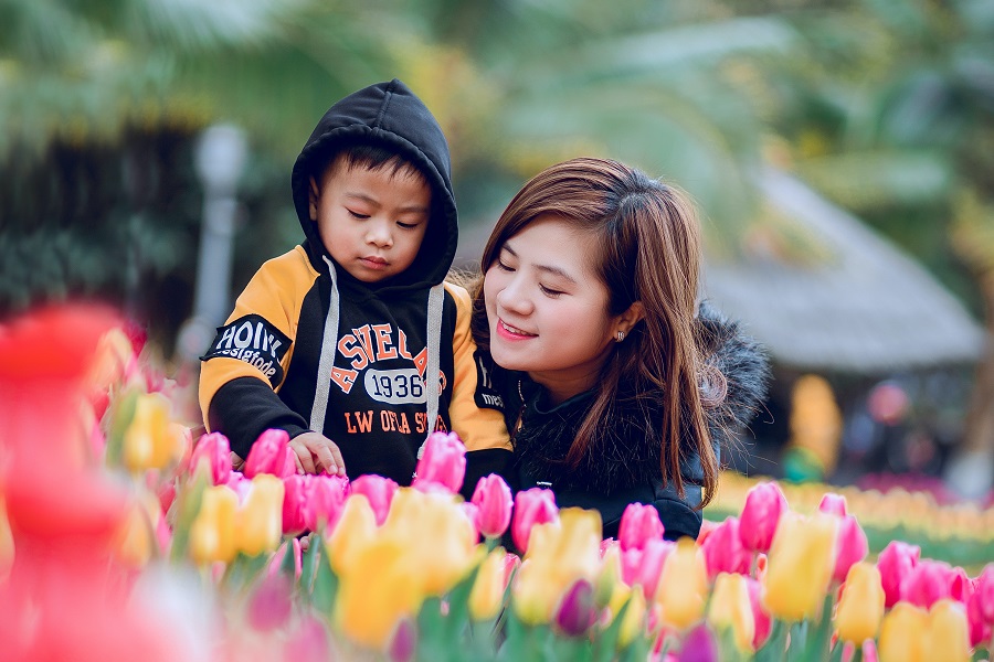 Brunch Recipes for Mother's Day a Mom with Her Son Looking at Colorful Tulips