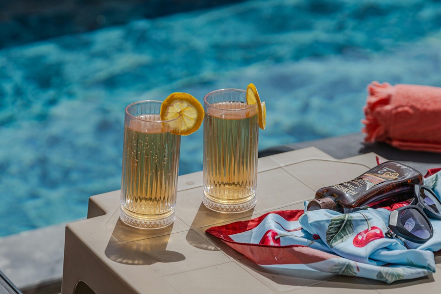Large Batch Cocktails Two Cocktails Sitting by a Pool