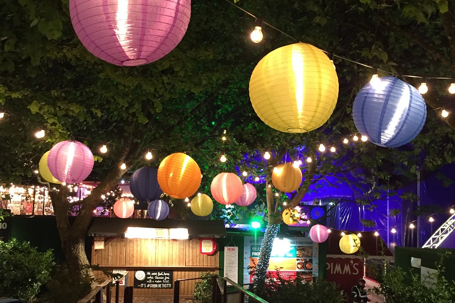 DIY Outdoor Lighting View of an Outdoor Party with Colorful Paper Lanterns Hanging Around