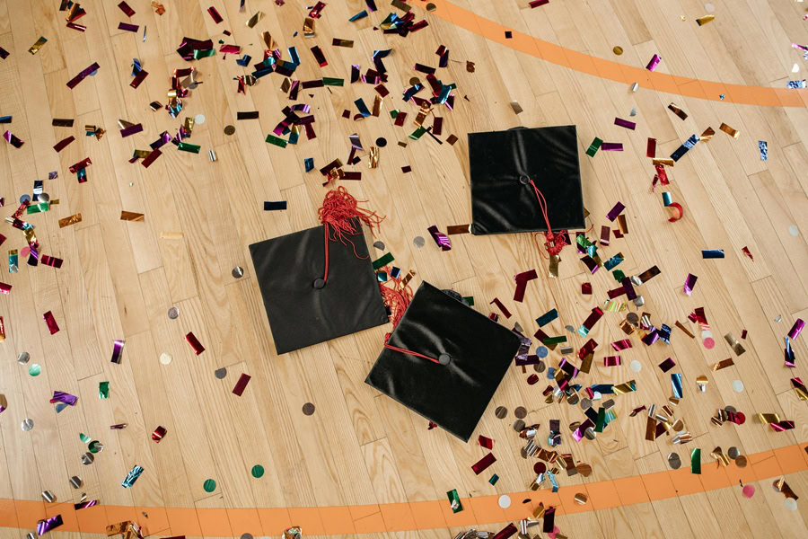 Easy Graduation Party Ideas Graduation Caps on a Gym Floor Covered in Confetti