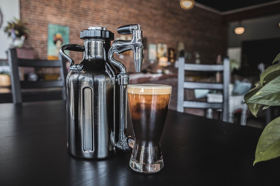 Fathers Day Gift Ideas Close Up of a Growlers with a Tap and a Glass of Beer Standing Next to it