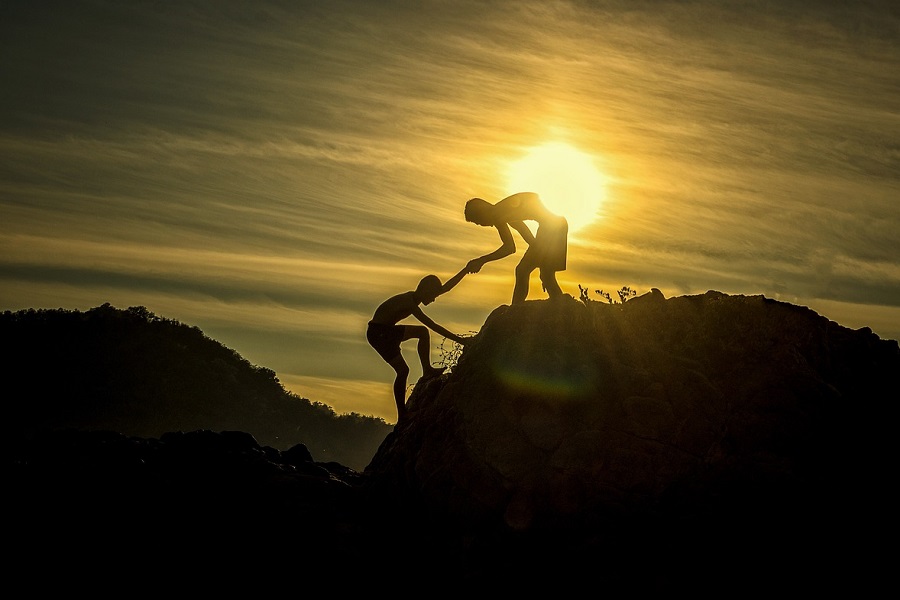 Friendship Quotes Two Friends Climbing a Mountain with One Leaning Over to Help The Other One Up