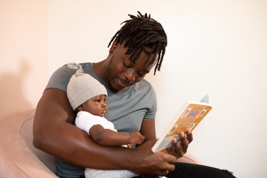 Fathers Day Gift Ideas a Father Reading to His Infant