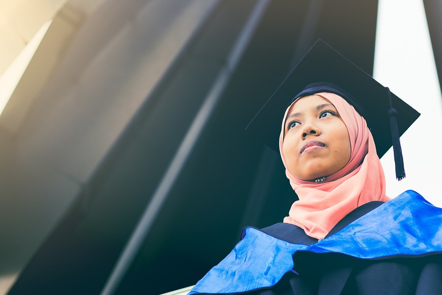 Graduation Gift Ideas Close Up of a Female Graduate Posing for a Photo with Her Graduation Cap On