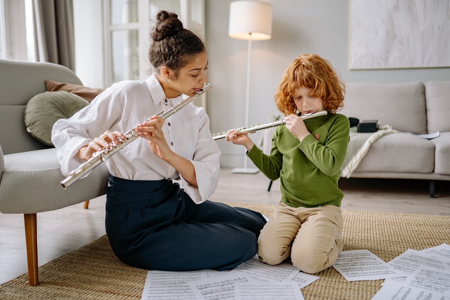Best Teacher Appreciation Gift Ideas a Music Teacher Playing a Flute with a Student