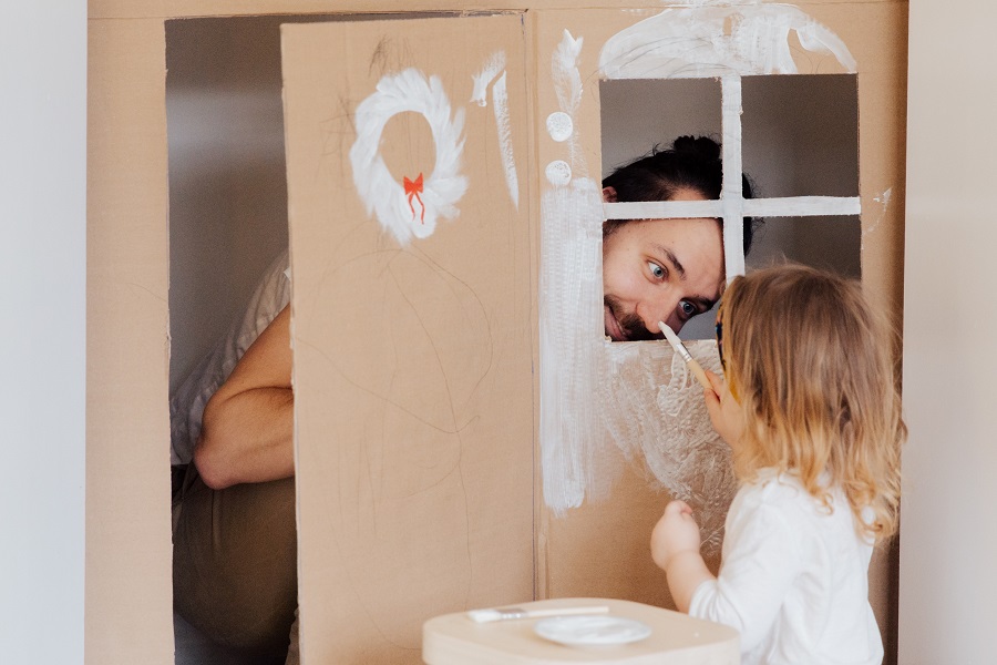 Funny Fathers Day Quotes a Father Playing in a Cardboard Playhouse with His Daughter