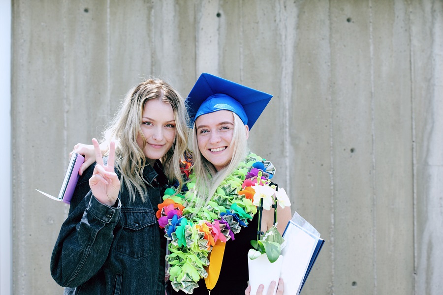 Grad Party Recipes a Teen Graduating Posing for a Picture with Her Mom