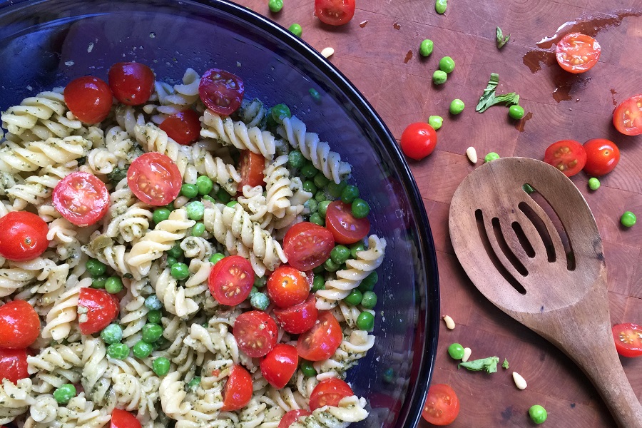 Pool Party Food Ideas Blue Bowl Filled with a Pasta Salad Next to a Wooden Spoon