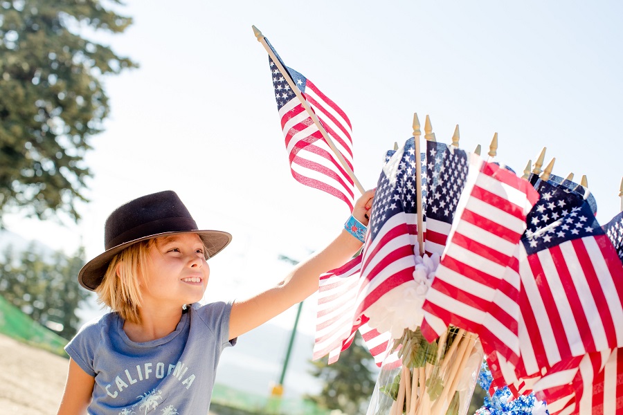 4th of July Nail Designs a  Child Reaching for a Small American Flag Outside