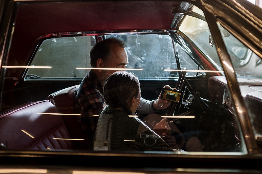 Fathers Day Gift DIYs View of a Father and Daughter Sitting in a Car and the Dad Teaching the Daughter About Cars