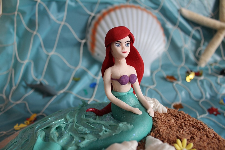 Little Mermaid Quotes Close Up of an Ariel Cake Topper
