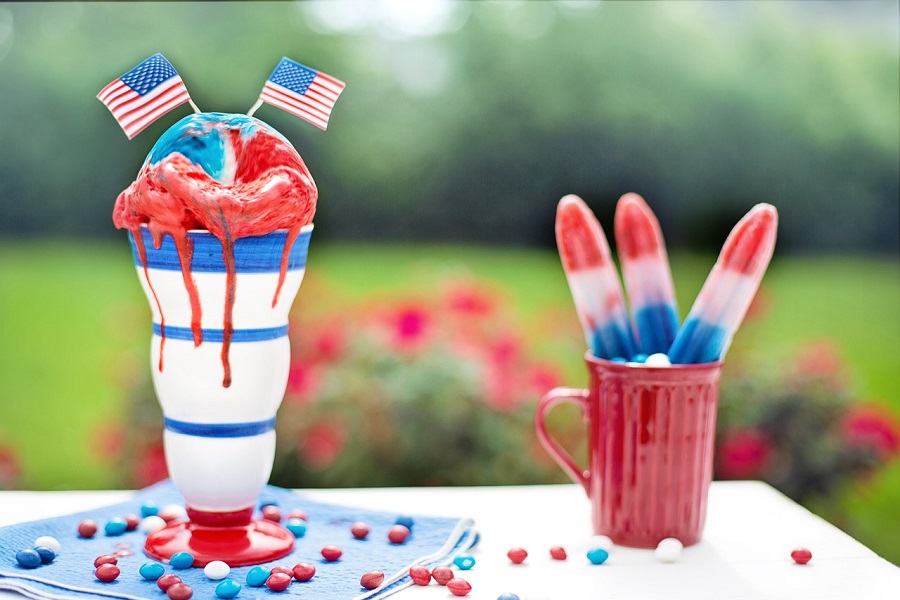 DIY 4th Of July Wreaths Red, White, and Blue Ice Cream Sitting on a Table Outside