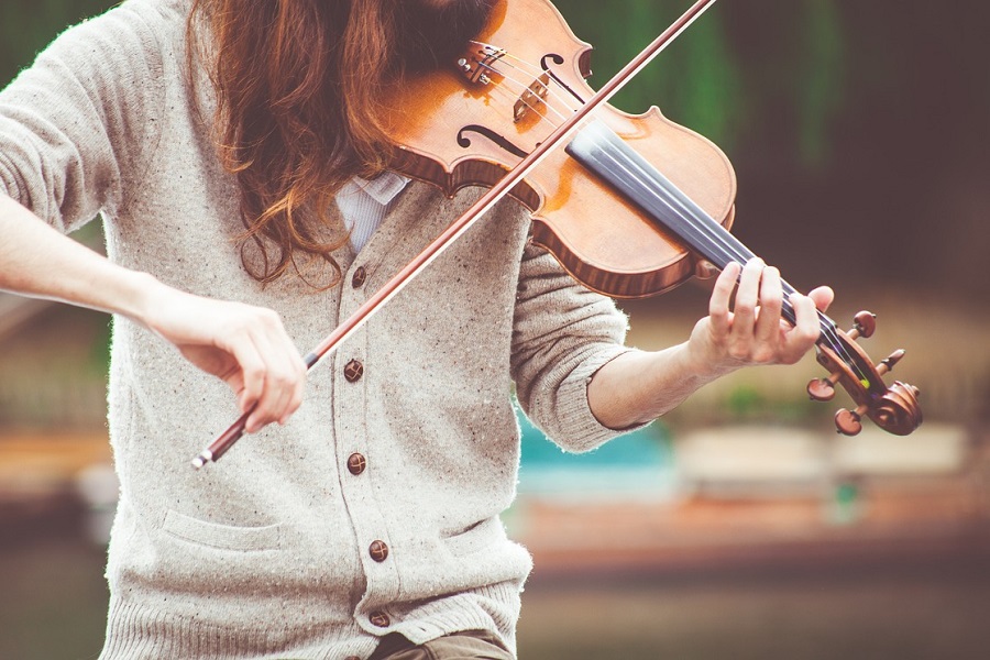 Music Quotes Close Up of a Woman Playing a Violin