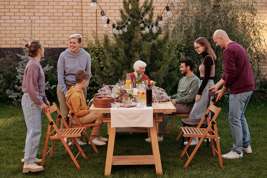 Summer Dinner Party Tips View of People Gathering Together for a Dinner Party