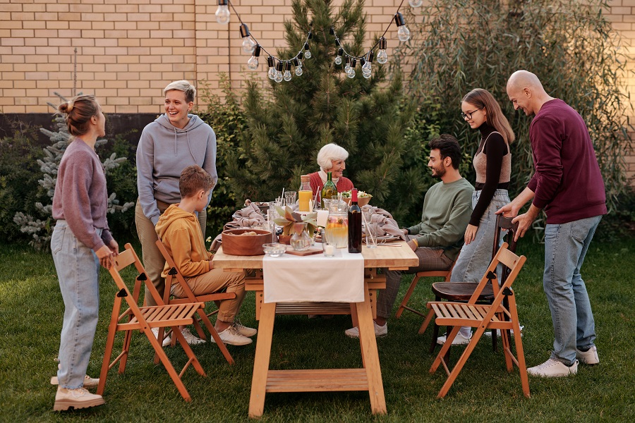 Summer Dinner Party Tips View of People Gathering Together for a Dinner Party