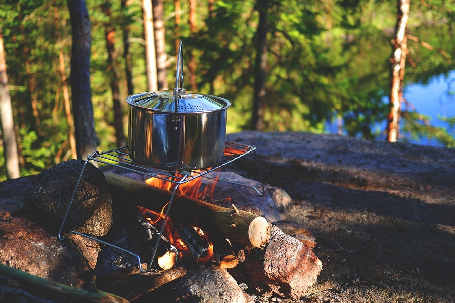Campfire Food Ideas Close Up of a Pot Hanging Over an Open Fire