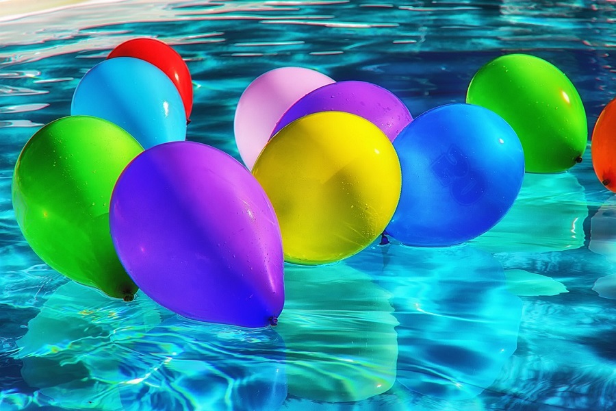 Pool Area Decorating Ideas Close Up of Colorful Balloons Floating in a Pool