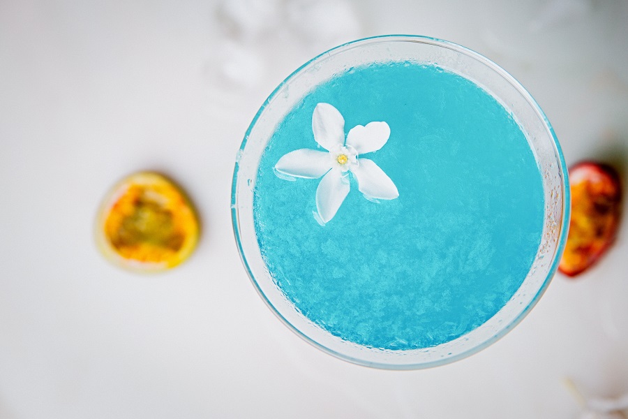 Frozen Cocktails Overhead View of a Blue Frozen Cocktail with a Small White Flower On Top