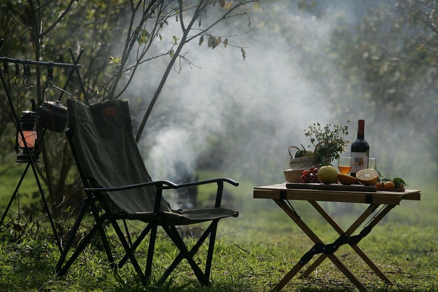 Campfire Food Ideas View of a Camping Site with a Small Table, Food, and Wine