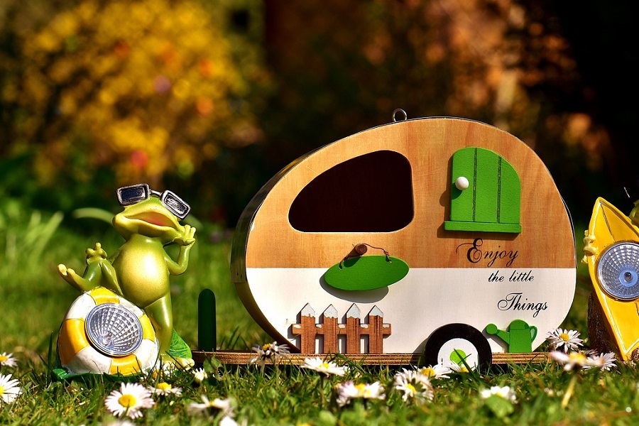 Small Camper Interior Ideas a Small Toy Camper Next to a Figure of a Frog Packing the Camper