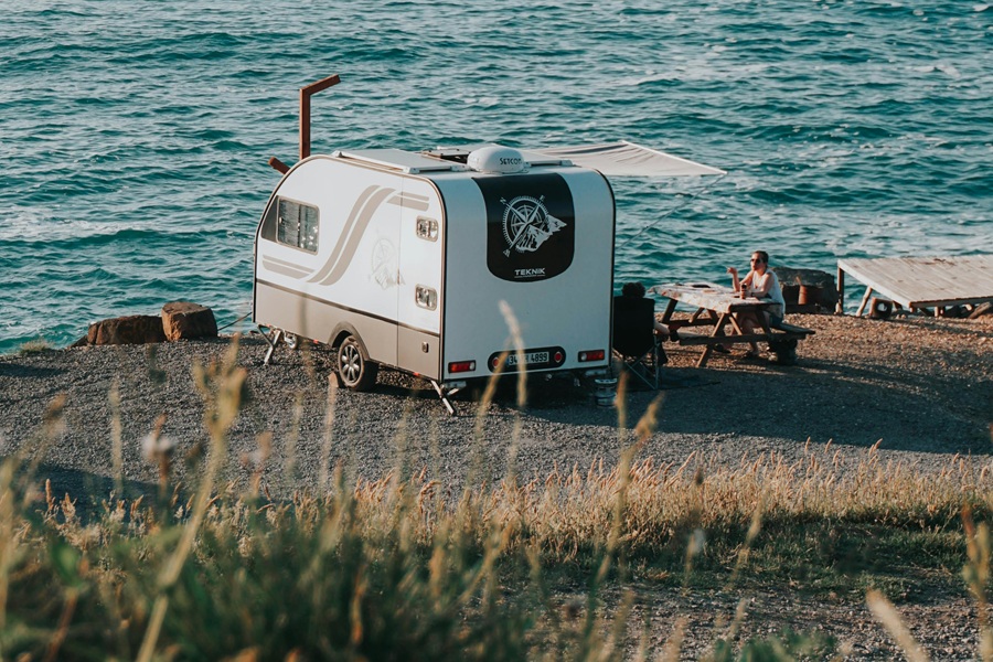 Small Camper Interior Ideas for Travelers a Camper Parked in a Parking Lot Near a Shoreline