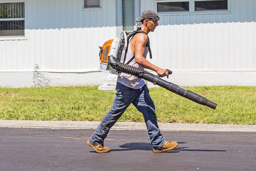 Funny Labor Day Weekend Memes a Man Wearing a Motorized Blower Backpack Walking in a Parking Lot