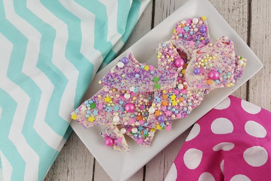 Barbie Party Recipes Close Up of Colorful Unicorn Bark on a White Plate