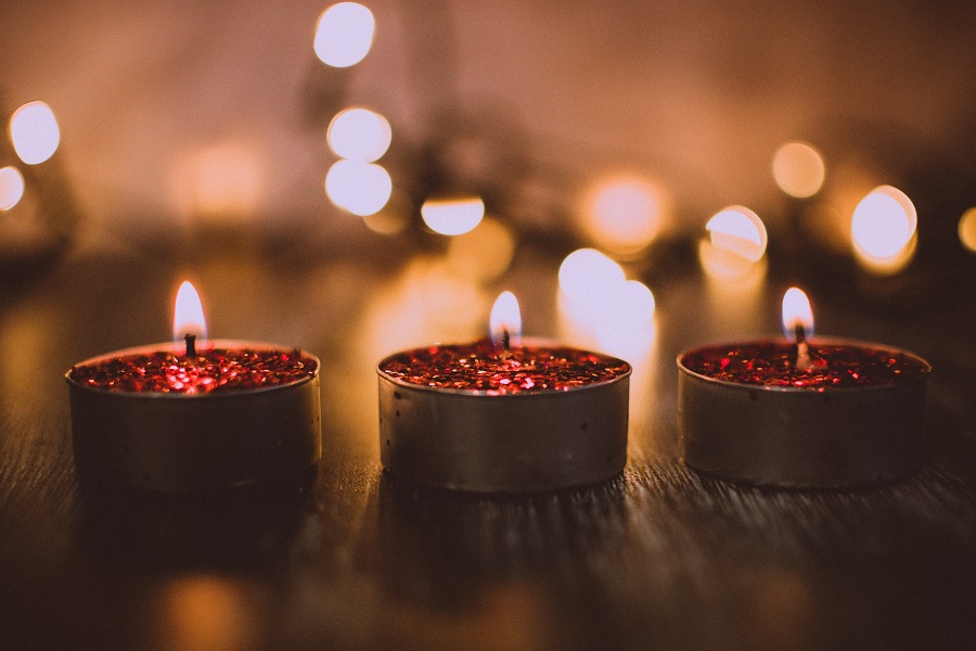 Cozy Fall Kitchen Decor Three Tea Candles Lit on a Dark Counter