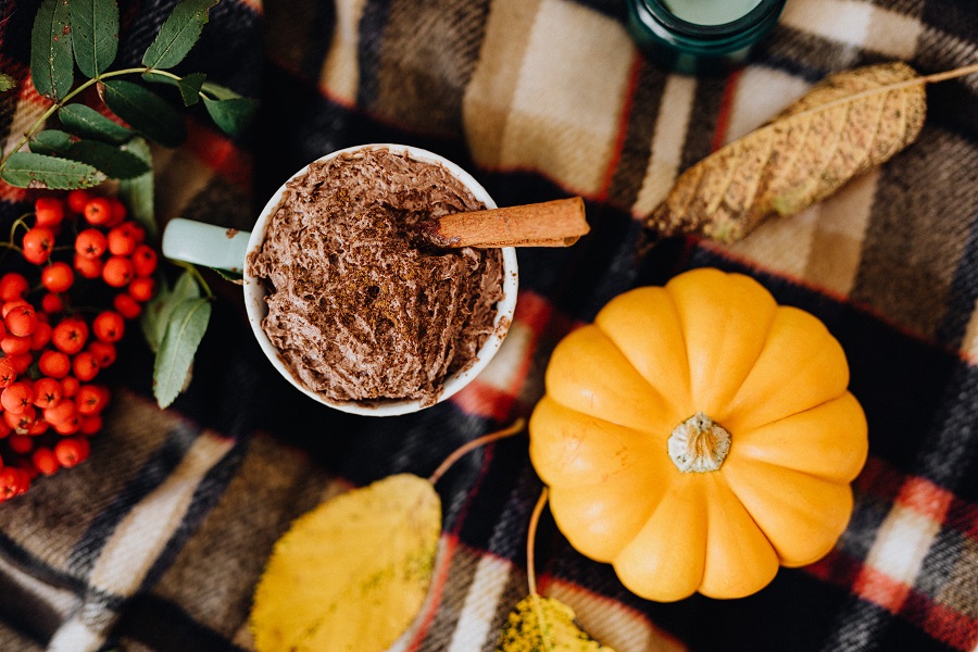 Cozy Fall Kitchen Decor Overhead View of a Cup of Hot Chocolate Next to a Small Pumpkin