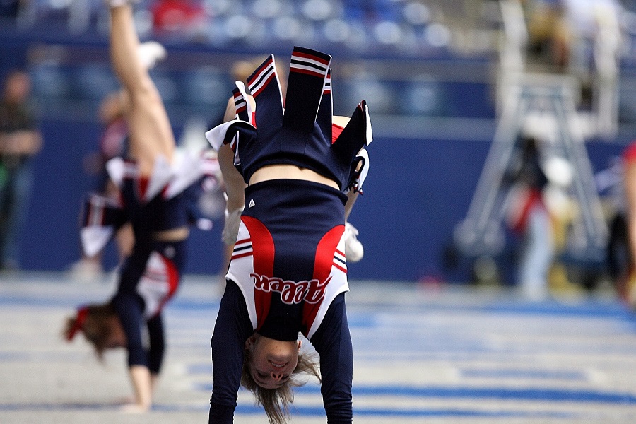 Cute Hoco Signs a Cheerleader Doing Stunts