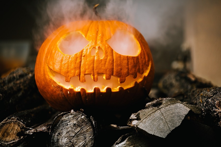 Halloween Jello Shots Recipes Close Up of a Jack-O-Lantern with Smoke Coming From the Eye Holes