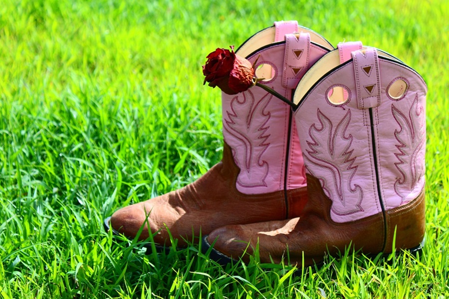 Country Western Nail Designs Close Up of Pink Cowgirl Boots in Grass