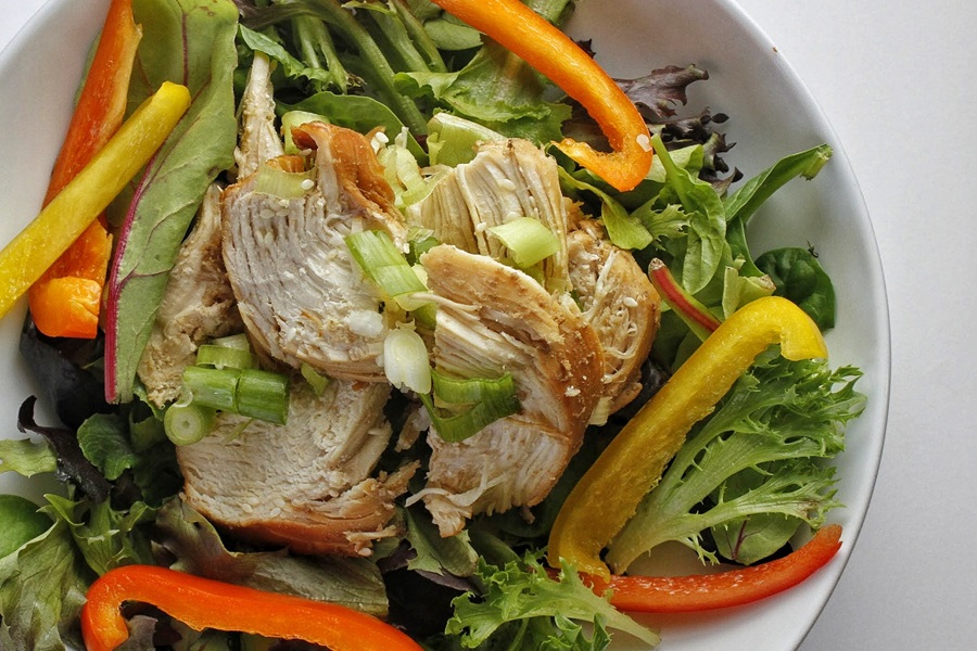 Healthy Teriyaki Chicken Recipe Close Up of a Salad Topped with Teriyaki Chicken and Bell Pepper Strips